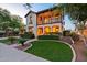 Charming two-story home boasting a welcoming front yard with lush landscaping and a second story balcony at 21104 W Sage Hill Rd, Buckeye, AZ 85396