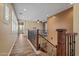 Spacious upstairs hallway with wood-look floors leading into the staircase at 21104 W Sage Hill Rd, Buckeye, AZ 85396