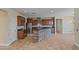 Modern kitchen features granite counters, stainless appliances, and stone island at 21104 W Sage Hill Rd, Buckeye, AZ 85396
