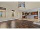 Bright living room with high ceilings, hardwood floors, and kitchen view at 21104 W Sage Hill Rd, Buckeye, AZ 85396