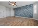 Spacious living room featuring tile floors, ample natural light, and stylish ceiling fan at 21104 W Sage Hill Rd, Buckeye, AZ 85396