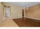 Inviting living room boasting hardwood floors and an elegant chandelier at 21104 W Sage Hill Rd, Buckeye, AZ 85396