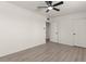 Neutral bedroom showcasing hardwood flooring and a ceiling fan at 2144 W 1St Pl, Mesa, AZ 85201