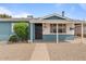 Inviting single story home with low maintenance desert landscaping and blue accents at 2144 W 1St Pl, Mesa, AZ 85201