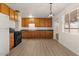 A bright kitchen with light cabinets, ample counter space, and stainless appliances at 2144 W 1St Pl, Mesa, AZ 85201