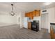 Kitchen seamlessly blends style and functionality with updated cabinets and stainless appliances at 2144 W 1St Pl, Mesa, AZ 85201