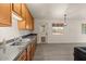 A well appointed kitchen boasts stainless steel sink, ample counter space and lots of light at 2144 W 1St Pl, Mesa, AZ 85201