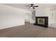 Bright living room with modern fireplace and built-in shelving at 2144 W 1St Pl, Mesa, AZ 85201