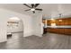 Spacious living room leading to a well-equipped kitchen with lots of room to cook at 2144 W 1St Pl, Mesa, AZ 85201