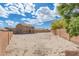 Large backyard with potential for landscaping, features a two-story home with patio at 21972 W Pima St, Buckeye, AZ 85326