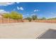 Spacious backyard area enclosed with block wall fencing, perfect for customization at 21972 W Pima St, Buckeye, AZ 85326