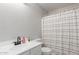 Clean bathroom featuring a modern vanity and shower with neutral tones and fixtures at 21972 W Pima St, Buckeye, AZ 85326