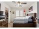 Inviting bedroom with a ceiling fan, natural light, and closet for storage solutions at 21972 W Pima St, Buckeye, AZ 85326