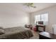Cozy bedroom with simple decor and functional layout, and a ceiling fan at 21972 W Pima St, Buckeye, AZ 85326