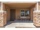 Inviting front porch with seating area, a perfect spot to relax and enjoy the neighborhood views at 21972 W Pima St, Buckeye, AZ 85326