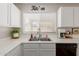 Bright and airy kitchen featuring a window over the sink and well-maintained appliances at 21972 W Pima St, Buckeye, AZ 85326