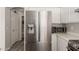 Open kitchen area featuring stainless steel refrigerator and updated countertop at 21972 W Pima St, Buckeye, AZ 85326