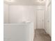 Upstairs landing featuring carpet flooring, white doors, and neutral walls at 21972 W Pima St, Buckeye, AZ 85326