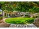 Manicured lawn with trees, landscape and covered patio at 236 W Calle Monte Vista Dr, Tempe, AZ 85284