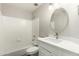 Bright bathroom with an oval mirror and white vanity at 236 W Calle Monte Vista Dr, Tempe, AZ 85284