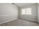 Neutral bedroom featuring carpet, base trim, and a window at 236 W Calle Monte Vista Dr, Tempe, AZ 85284