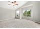 Bright bedroom with a ceiling fan and windows with views at 236 W Calle Monte Vista Dr, Tempe, AZ 85284