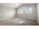 Spacious bedroom featuring plush carpet, vaulted ceiling, and plantation shutters at 236 W Calle Monte Vista Dr, Tempe, AZ 85284