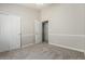 Comfortable bedroom with carpet and paneled doors at 236 W Calle Monte Vista Dr, Tempe, AZ 85284