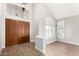 Bright foyer with a grand entrance, vaulted ceilings, wooden floors, and double front doors at 236 W Calle Monte Vista Dr, Tempe, AZ 85284