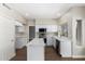 Modern kitchen featuring an island, white cabinetry, and stainless steel appliances at 236 W Calle Monte Vista Dr, Tempe, AZ 85284