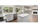 Bright kitchen featuring stainless steel appliances, white cabinetry, and wood flooring at 236 W Calle Monte Vista Dr, Tempe, AZ 85284