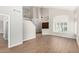 Spacious living room with wood floors, light walls, tall ceilings, and a view of the home's entryway at 236 W Calle Monte Vista Dr, Tempe, AZ 85284
