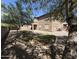 Large backyard featuring gravel, grass, mature trees, and well-defined yard edges at 2670 S Dragoon Dr, Chandler, AZ 85286