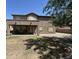 Expansive backyard with covered patio, gravel landscaping, and lush green grass area for outdoor living at 2670 S Dragoon Dr, Chandler, AZ 85286