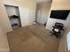 Clean bedroom featuring carpeted floors, a closet, and a television at 2670 S Dragoon Dr, Chandler, AZ 85286