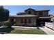 Elegant two-story home featuring a tile roof, arched windows, and well-maintained landscaping in a suburban setting at 2670 S Dragoon Dr, Chandler, AZ 85286