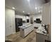 Well-lit kitchen featuring white cabinets, stainless steel appliances, granite countertops, and a functional center island at 2670 S Dragoon Dr, Chandler, AZ 85286