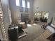Bright living room with high ceilings and multiple windows, offering ample space and natural light at 2670 S Dragoon Dr, Chandler, AZ 85286