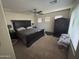 Cozy main bedroom featuring a dark wood furniture set and comfortable bedding at 2670 S Dragoon Dr, Chandler, AZ 85286