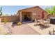 Backyard with covered patio, outdoor seating area, and desert landscaping at 28834 N Spur Dr, San Tan Valley, AZ 85143