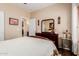 Bedroom features wood floors, a dresser, decorations, and view to other rooms at 28834 N Spur Dr, San Tan Valley, AZ 85143