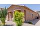 Front exterior view of a well kept single story home featuring xeriscaping for low maintenance at 28834 N Spur Dr, San Tan Valley, AZ 85143