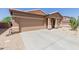 Attractive single story home with a neutral stucco exterior, a two car garage, and low maintenance landscaping at 28834 N Spur Dr, San Tan Valley, AZ 85143