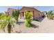Well maintained single story house with neutral stucco, xeriscaping, and covered front porch at 28834 N Spur Dr, San Tan Valley, AZ 85143