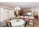 Eat-in kitchen featuring granite counters, stainless appliances, seating, and view of window with natural light at 28834 N Spur Dr, San Tan Valley, AZ 85143