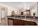 The open kitchen includes a granite countertop, stainless steel sink, and easy access to the living and dining areas at 28834 N Spur Dr, San Tan Valley, AZ 85143