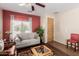 Comfortable living room has hardwood floors, lots of natural light, and comfortable seating for friends and Gathering at 28834 N Spur Dr, San Tan Valley, AZ 85143