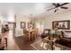 Open living and dining area features hardwood floors, comfortable seating, and lots of natural light at 28834 N Spur Dr, San Tan Valley, AZ 85143