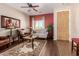 Inviting living room featuring hardwood floors, a ceiling fan, and comfortable seating for Gathering and guests at 28834 N Spur Dr, San Tan Valley, AZ 85143