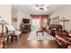 Inviting living room features hardwood floors, a cozy fireplace, and a sliding glass door to the outdoor space at 28834 N Spur Dr, San Tan Valley, AZ 85143